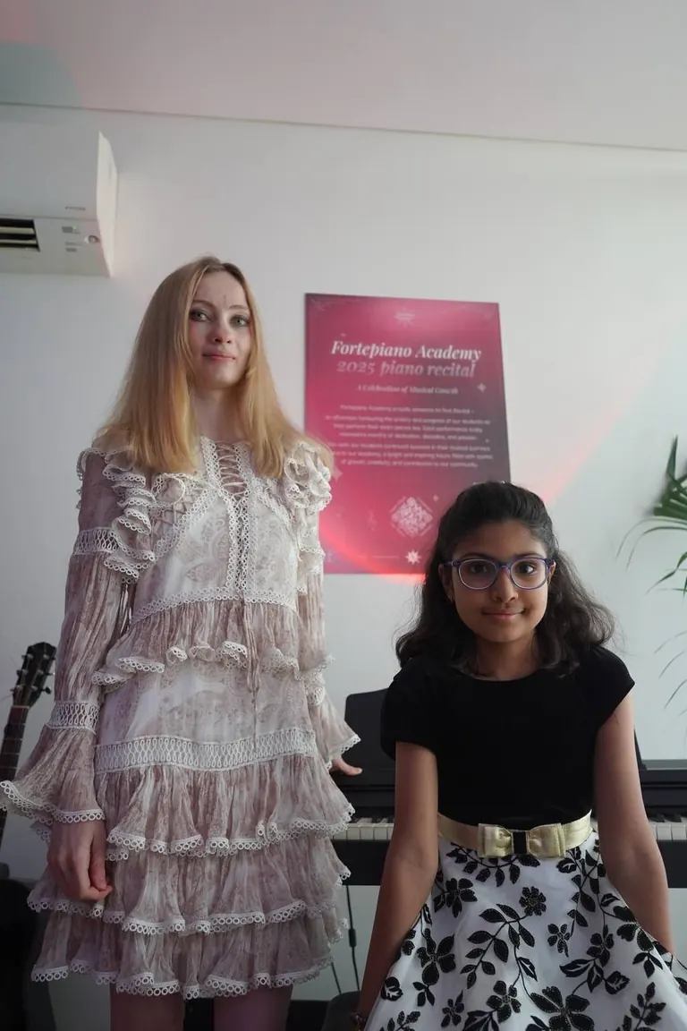 Liana Pavlicheva with student Jennie at a Fortepiano Academy recital